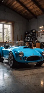 Vintage blue sports car in rustic garage setting.