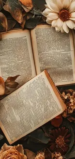Vintage open books surrounded by dried flowers.