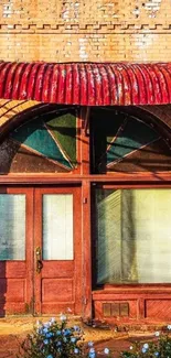 Rustic brick facade with vintage door and floral accents.