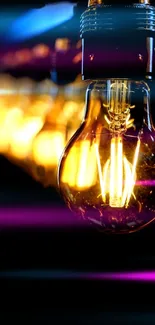 Vintage light bulb glowing in the dark for mobile wallpaper.