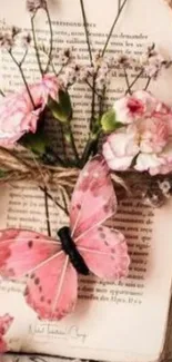 Vintage wallpaper with pink butterfly and flowers on an old book.