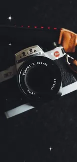 Close-up of a vintage camera lens on a dark background.