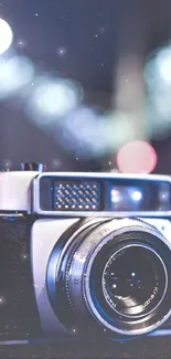 Vintage camera with bokeh lights mobile wallpaper.