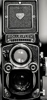 Black and white image of a vintage Rolleiflex camera.