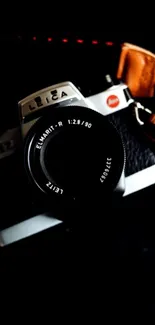 Close-up of a vintage film camera with lens.