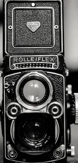 Vintage black and white camera emphasizing retro photography style.