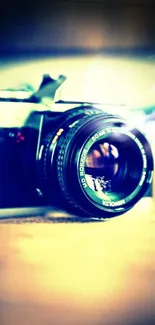 Artistic vintage camera with lens focus, captured in cool tones.