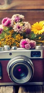 Vintage camera with colorful flowers backdrop.
