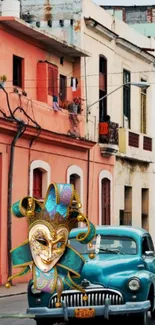 Vintage car with carnival mask on colorful street.