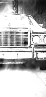 Vintage car in black and white with smoky background.