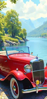Vintage red car by a lake with scenic mountains.