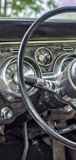 Vintage car dashboard with steering wheel and classic design.