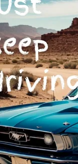 Vintage blue car driving through desert landscape with inspiring text.