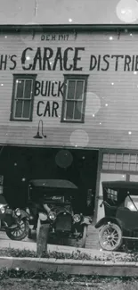 Vintage car garage with classic automobiles in black and white.