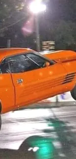 Dynamic vintage car wallpaper showcasing a classic orange muscle car in motion.