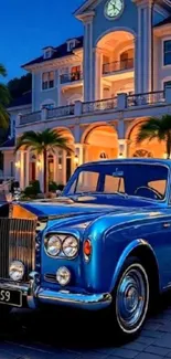 Vintage blue car parked in front of a luxurious mansion during evening.