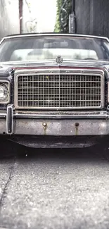 Vintage car parked in a narrow urban alley, showcasing classic design.