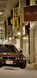 Vintage car on a dimly lit urban street at night.