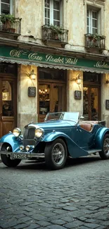 Vintage blue car on cobblestone street in European city.