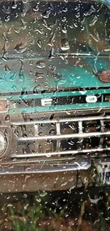 Vintage teal car with raindrops on windshield, close-up view.