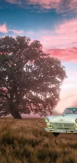 Vintage car under a pastel sky with a solitary tree in a scenic landscape.