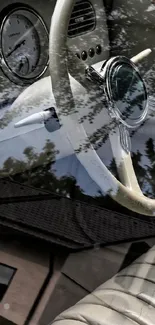 Vintage car interior with steering wheel and dashboard reflection.