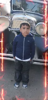 Child stands in front of vintage car with flame effects in background.