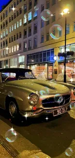 Vintage car parked on a city street at night with illuminated bubbles.