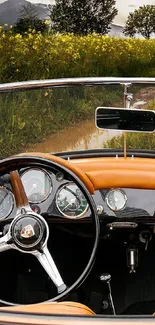 Vintage car interior with scenic countryside view.