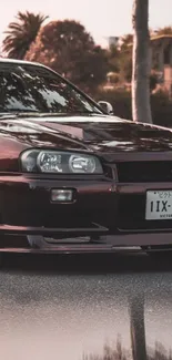 Vintage car against sunset backdrop, creating a classic aesthetic for mobile screens.