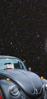 Vintage black car with starry sky background in mobile wallpaper.