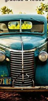 Vintage blue car in a scenic setting.