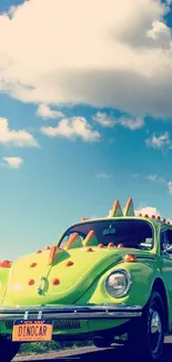 A vintage green car with dinosaur spikes under a vibrant blue sky filled with clouds.