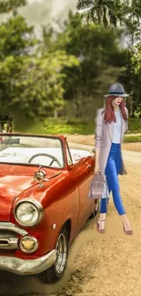 Fashionable woman by vintage red car in nature.