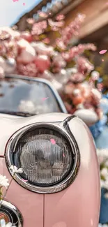 Vintage car with pink floral decoration.