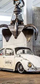 Vintage Volkswagen Beetle under industrial claw in a garage setting.