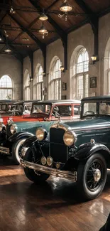 Vintage cars parked in a classic garage with elegant lighting.