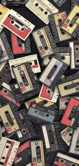 A collection of vintage cassette tapes scattered on a dark background.