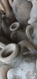 Close-up of ancient clay pots with rustic texture.