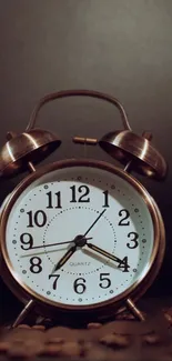 Close-up of a vintage alarm clock on a dark background.