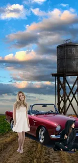 Vintage car with countryside backdrop and vibrant sky.