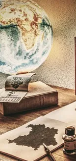 Vintage desk with a glowing globe and antique decor.