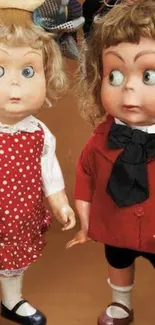 Two charming vintage dolls in classic attire on a brown backdrop.