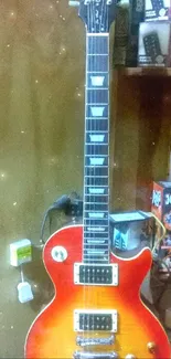 Vintage electric guitar against a wooden background.