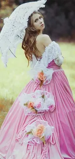 Woman in elegant pink dress with floral details and lace umbrella.