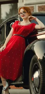 Woman in red dress leaning on a vintage car with a historic building backdrop.