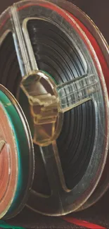 Close-up of vintage film reels with brown background.