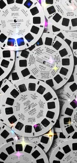 Collage of vintage black and white film reels, creating a retro aesthetic.