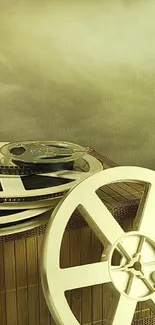 Vintage film reels on wooden background.