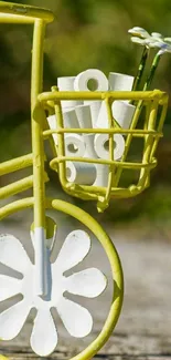 Vintage bicycle with floral design in yellow and white.